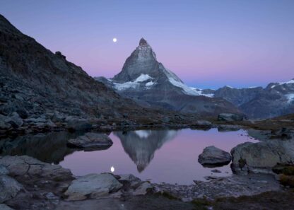 Matterhorn and Riffelsee lake at twilight with full moon poster