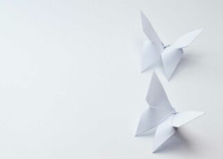 White origami butterflies on white background poster