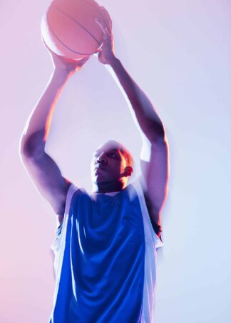Basketball player in pitching pose poster