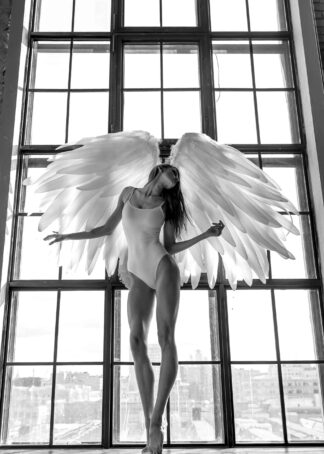 A girl with angel wing beside the window poster