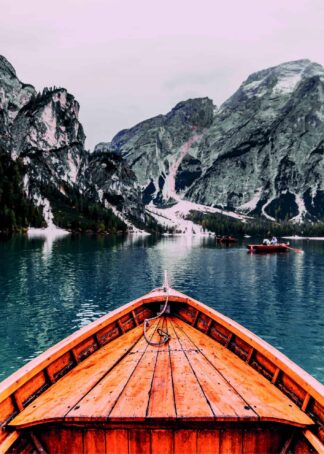 Wooden boat in the mountain lake poster