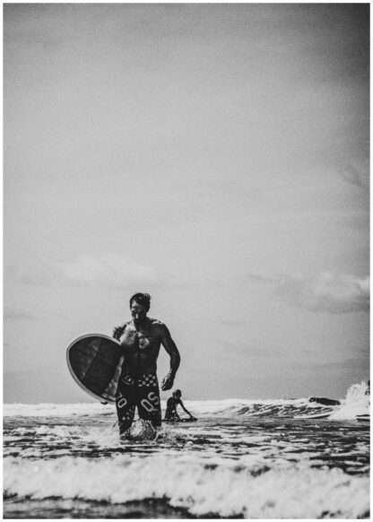 Surfer walking with board poster