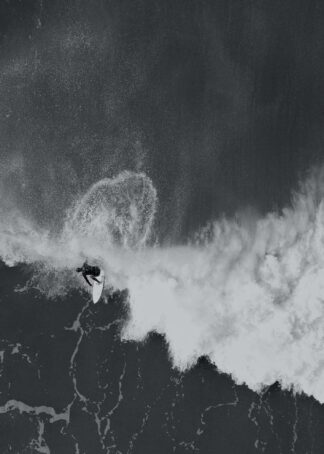 Surfer mastering a wave poster